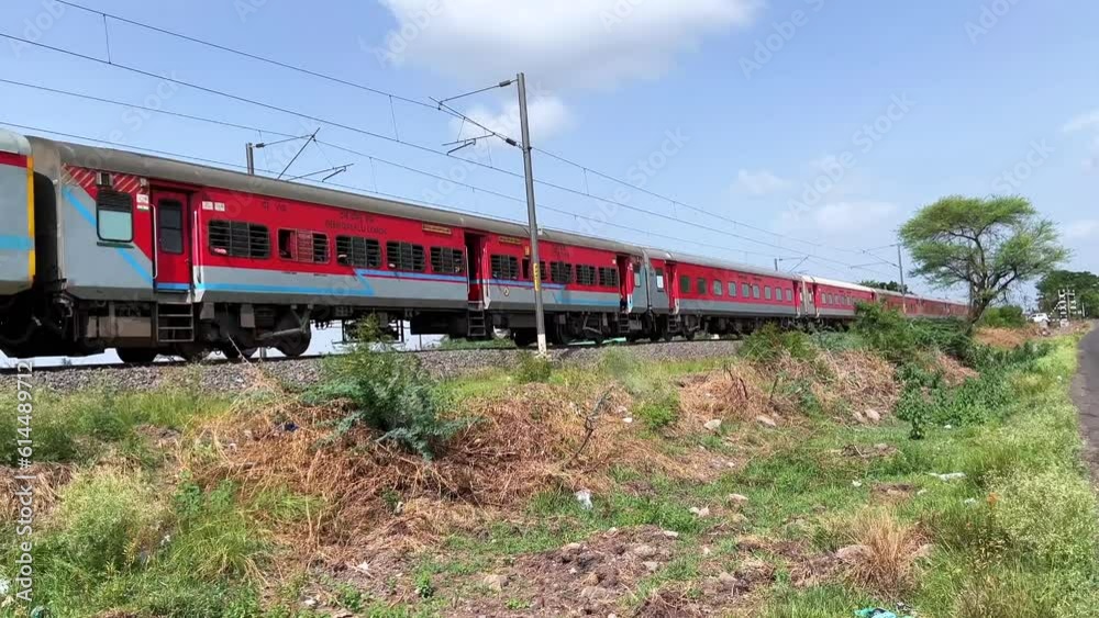 Passenger Train hauled by a WAP7 loco heads towards Pune, at Uruli near Pune India. Passenger Train hauled by a WAP7 loco heads towards Pune, at Uruli near Pune India.