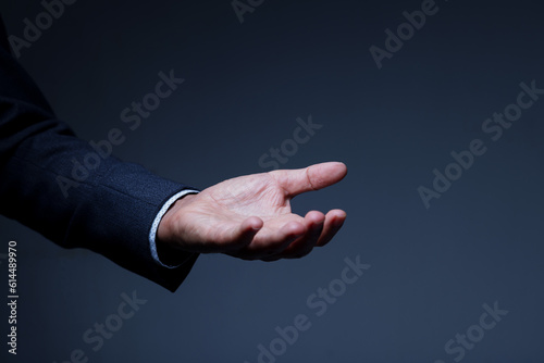 businessman in suit hand gesture with open palm