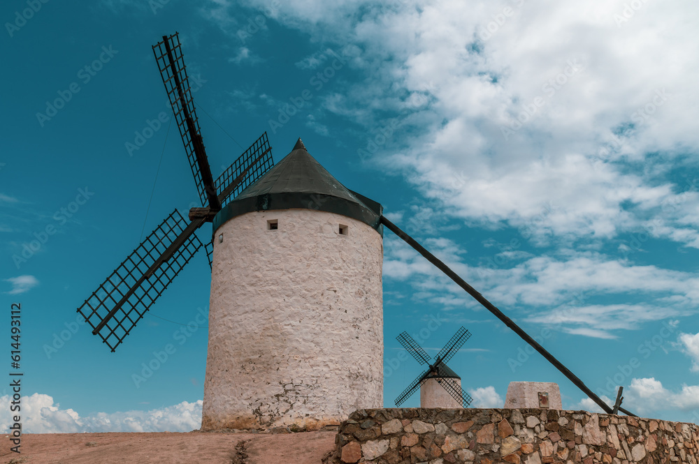 Old stone windmills on a hill above the Toledo town of Consuegra (Spain)