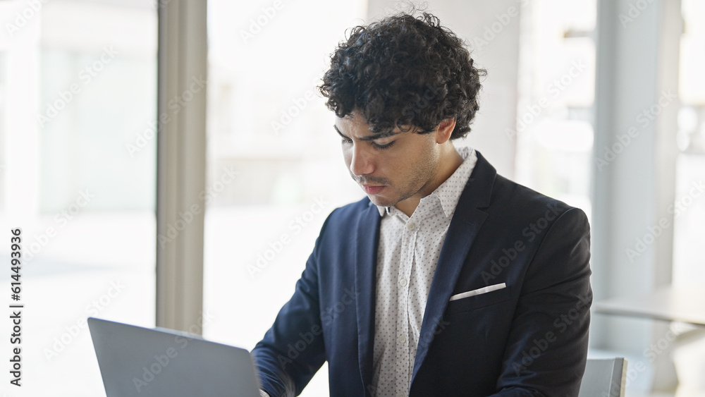 Young latin man business worker using laptop at office Young latin man business worker using laptop at office