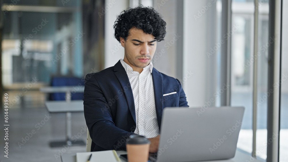 Young latin man business worker using laptop at office Young latin man business worker using laptop at office