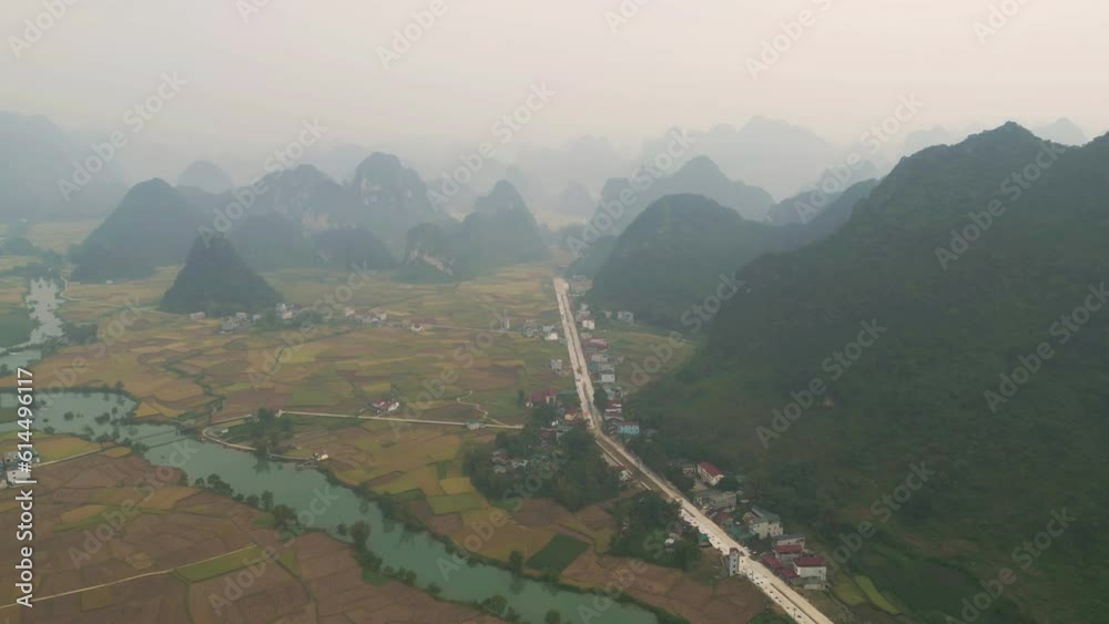 Aerial top view of fresh paddy rice terraces, green agricultural fields in countryside or rural area of Cao Bang, mountain hills valley in Asia, Vietnam, China border. Nature landscape background. Aerial top view of fresh paddy rice terraces, green agricultural fields in countryside or rural area of Cao Bang, mountain hills valley in Asia, Vietnam, China border. Nature landscape background.