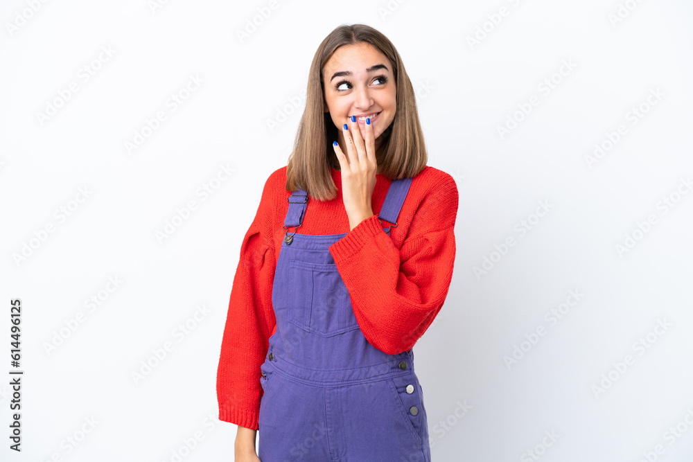 Young caucasian woman isolated on white background looking up while smiling Young caucasian woman isolated on white background looking up while smiling