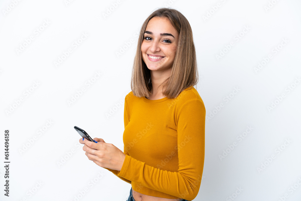 Young caucasian woman isolated on white background sending a message or email with the mobile Young caucasian woman isolated on white background sending a message or email with the mobile