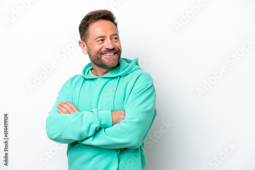 Middle age caucasian man isolated on white background with arms crossed and happy © luismolinero