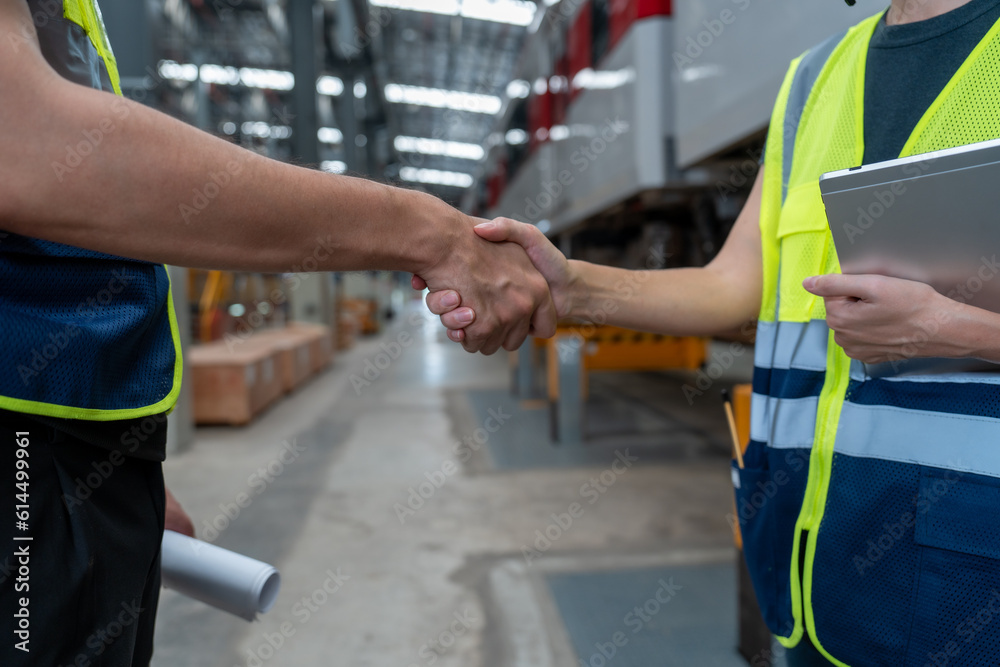 Technical staff and engineers shaking hands