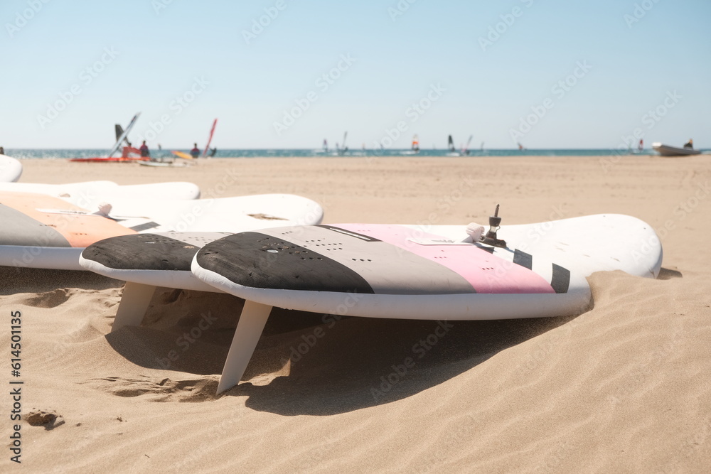 wind surfing board lies in the sand of prassonisi beach, RHODES ISLAND wind surfing board lies in the sand of prassonisi beach, RHODES ISLAND