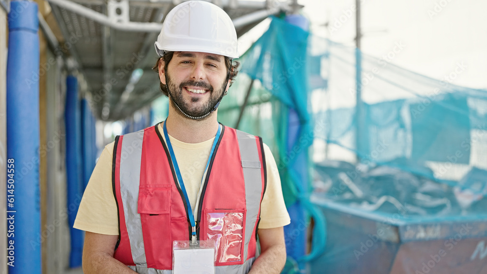 Young hispanic man builder smiling confident standing at street Young hispanic man builder smiling confident standing at street