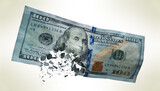 Broken US paper money on a grey background