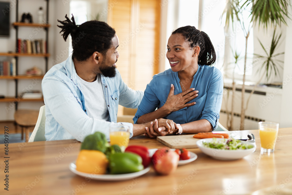 Happy African American couple having fun during breakfast time at home Happy African American couple having fun during breakfast time at home