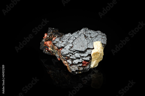 magnetite with hematoid quartz isolated on black background. macro detail texture. close-up polished semi-precious gemstone.