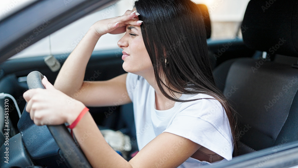 Young beautiful hispanic woman stressed driving car at street Young beautiful hispanic woman stressed driving car at street