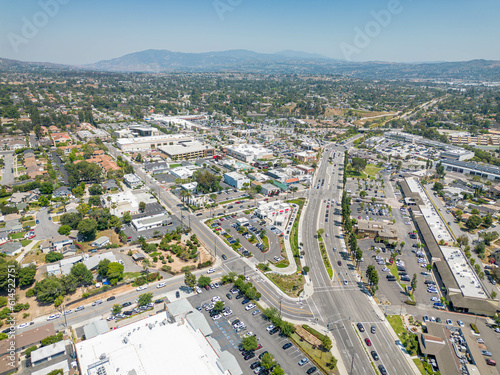 Yorba Linda, California - June 17, 2023: aerial drone photo view toward Village Green Shopping Center including Yorba Linda Main Street, Bristol Farms, Regal Yorba Linda, In-N-out Burger, on Yorba Lin
