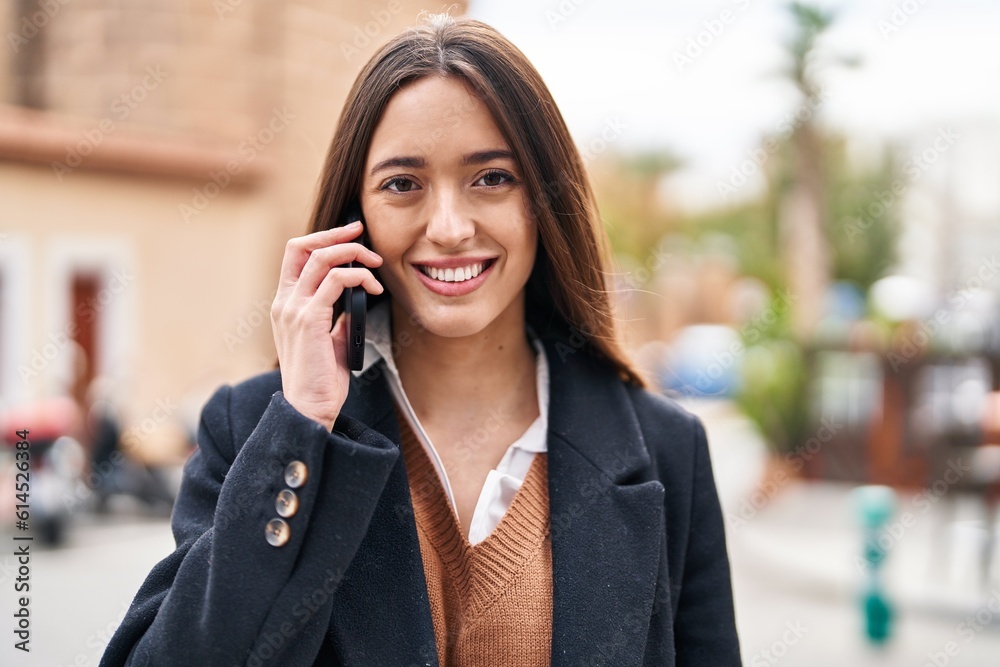 Young beautiful hispanic woman smiling confident talking on the smartphone at street Young beautiful hispanic woman smiling confident talking on the smartphone at street