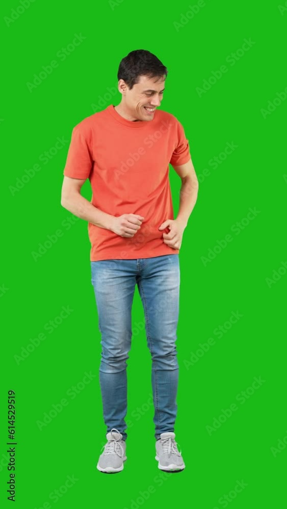 Shy man in light studio. Green background Shy man in light studio. Green background