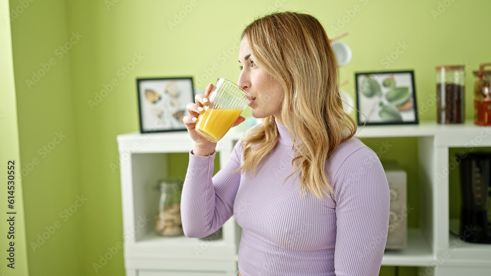 Young beautiful hispanic woman drinking juice at dinning room Young beautiful hispanic woman drinking juice at dinning room