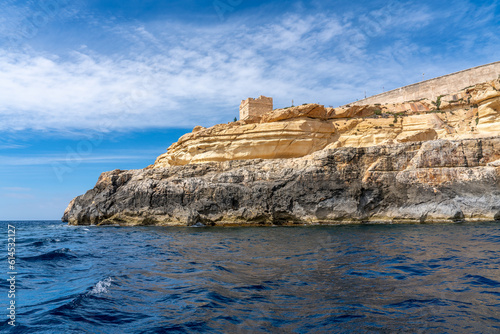 Malta, near the habour of Wied iz-Zurrieq, an  old watchtower seen from the seaside when coming back from the blue grottos.