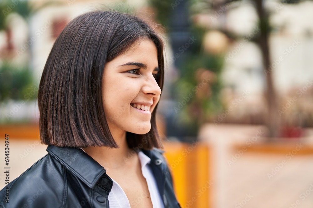 Young beautiful hispanic woman smiling confident looking to the side at park