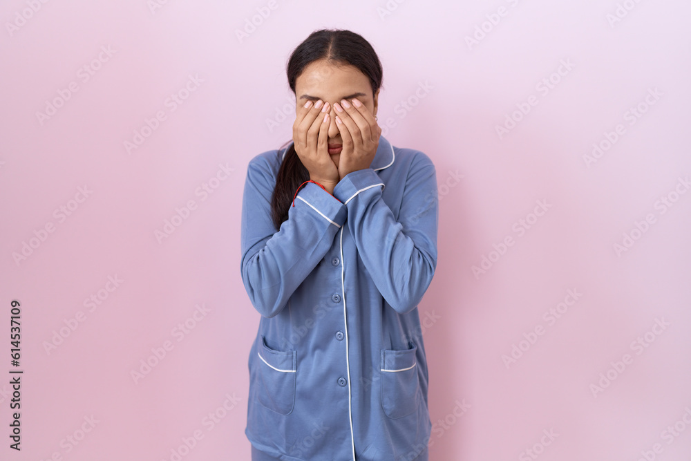 Young arab woman wearing blue pajama rubbing eyes for fatigue and headache, sleepy and tired expression. vision problem