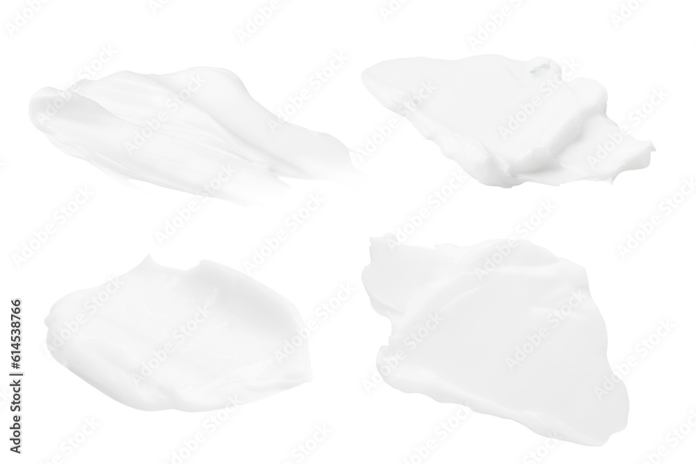 A set of different strokes of white cream on a blank background. PNG