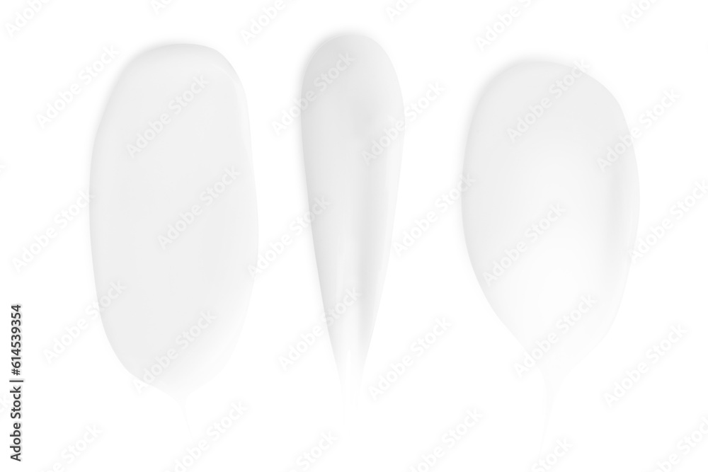 A set of different strokes of white cream on a white background. A set of different strokes of white cream on a white background.