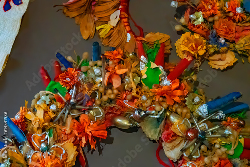 Dry compositions and bouquets of flowers and plants for the interior lie on a white wooden table. Flower wreath