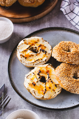 Sweet creme brulee bagels with cream cheese and caramelized sugar for breakfast vertical view