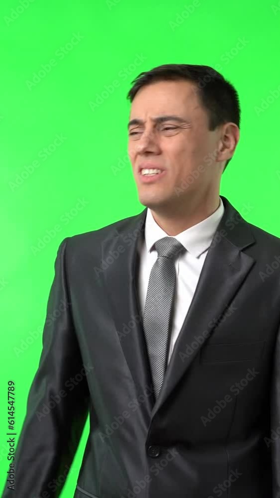 Stressed and desperatemale entrepreneur trying to loosen tie Stressed and desperatemale entrepreneur trying to loosen tie