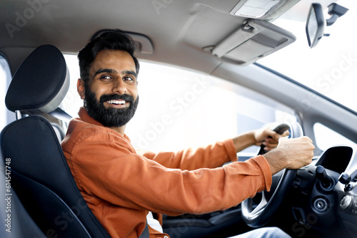 Indian Car Owner Guy Sitting In Driver's Seat In Vehicle
