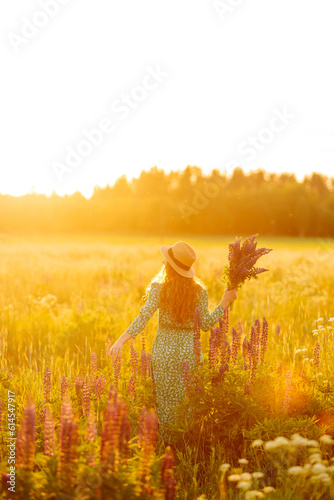 Beautiful woman in the blooming lavender field. Nature, vacation, relax and lifestyle. Summer landscape.