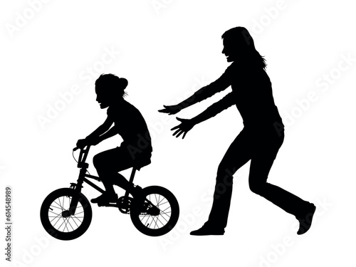 Mother teaching son to ride  bicycle vector silhouette.
