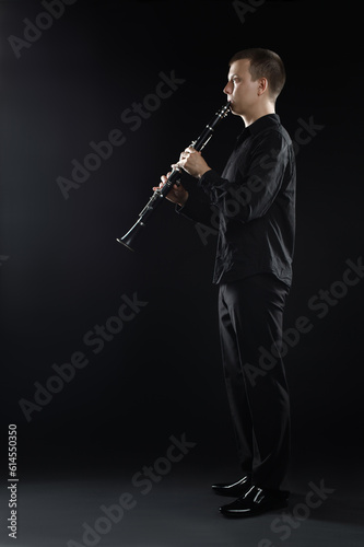 Clarinet player classical musician. Man playing clarinette
