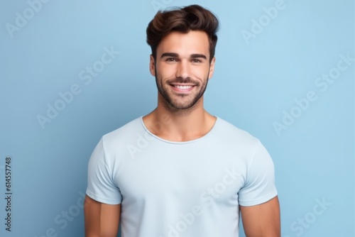 Portrait of a muscular handsome guy wearing a plain t-shirt, isolated on a pastel background. Generative AI illustration.