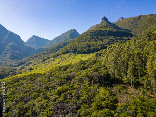 Aerial view of a valley with forest and rocks