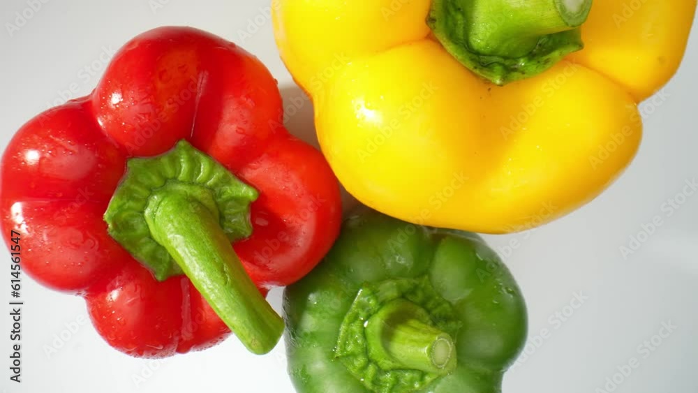 The macro video featuring succulent green, fiery red, and sunny yellow bell peppers. The intricate details of their textured skins come alive as each pepper is adorned with delicate droplets of water
The macro video featuring succulent green, fiery red, and sunny yellow bell peppers. The intricate details of their textured skins come alive as each pepper is adorned with delicate droplets of water