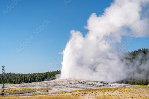 Old Faithful geyser erupting, Yellowstone National Park.