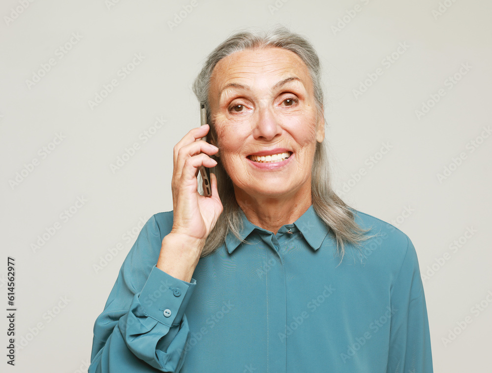 happy senior woman with smartphone calling with friends happy senior woman with smartphone calling with friends