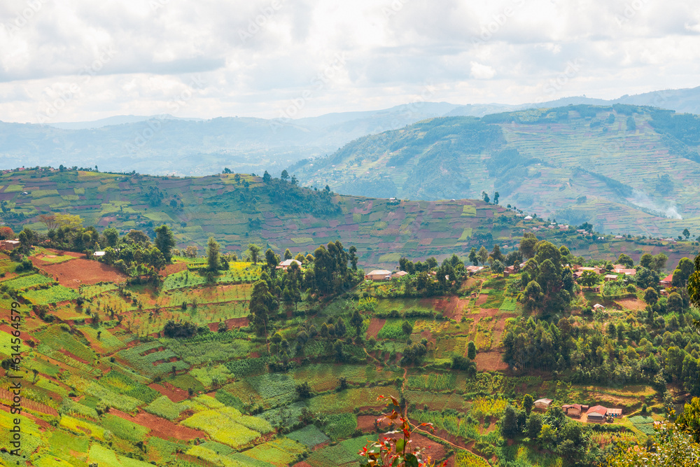 African landscapes with villages against Mount Muhabura in the  background at Kisoro, Uganda