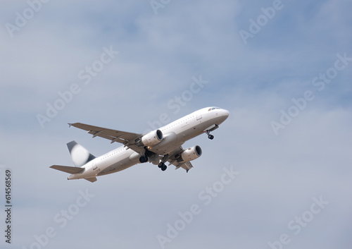 Airplane taking off against the sky,Travel concept,Beautiful Panoramic Background with flying plane in blue sky. Passenger airplane