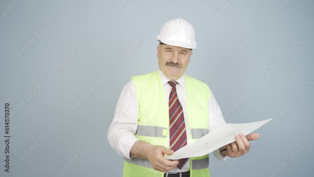 Engineer looking at camera and making positive gesture. Engineer looking at camera and making positive gesture.