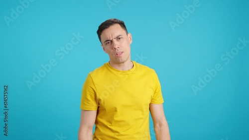 Man shaking his head and looking at the camera