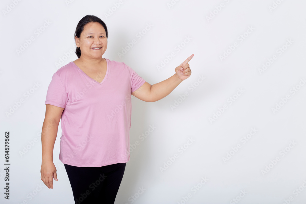 Beautiful Asian plus-size woman smiles with positive emotion, feeling happy and proud of her body overweight. Portrait shot on white background with copy space. Beautiful Asian plus-size woman smiles with positive emotion, feeling happy and proud of her body overweight. Portrait shot on white background with copy space.