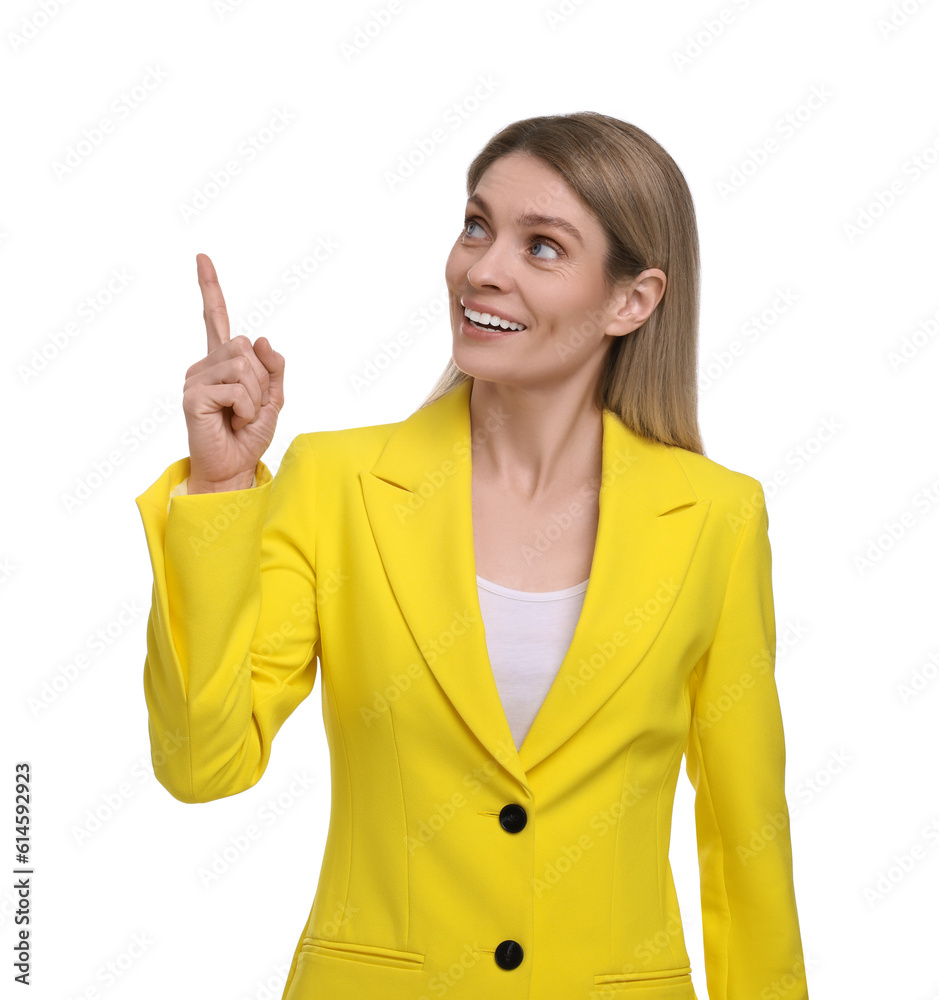 Beautiful happy businesswoman pointing at something on white background Beautiful happy businesswoman pointing at something on white background