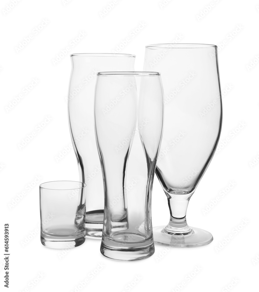 Different elegant empty glasses isolated on white Different elegant empty glasses isolated on white