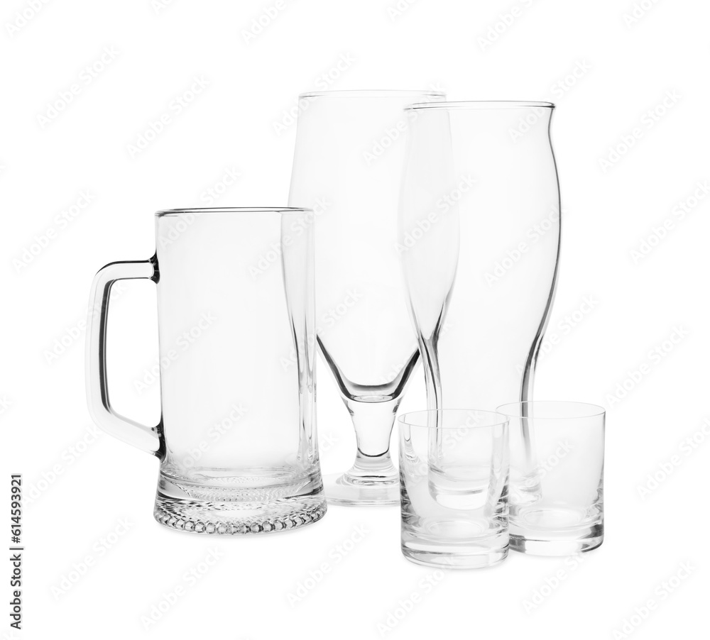 Different elegant empty glasses isolated on white Different elegant empty glasses isolated on white