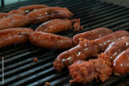 Grilled juicy chorizo sausages on a grill