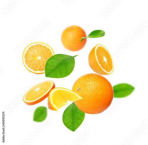 Cut and whole oranges with green leaves flying on white background