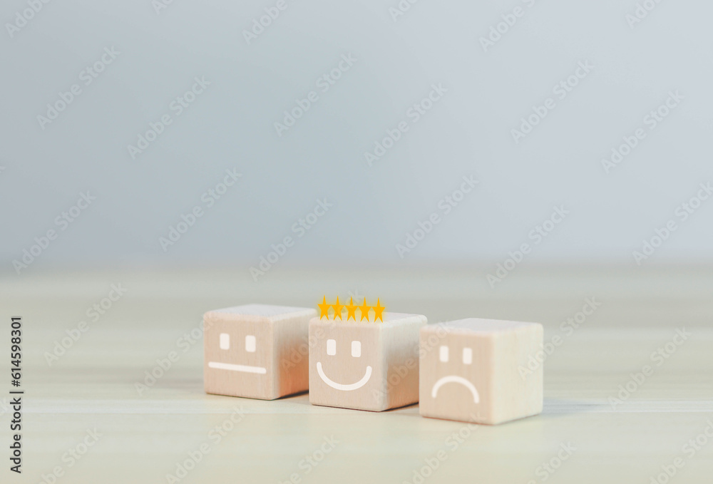 Emotional face symbols on wooden blocks Ratings, services, ratings, customer reviews, satisfaction, evaluations, experiences and quality product marketing recommendations.