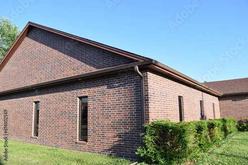 Wallpaper Mural Shrubs by a Brick Building Torontodigital.ca