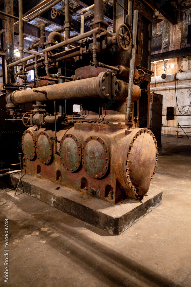 View of an old machine in an abandoned factory.